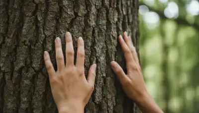 A highly detailed, macro photograph of a person's hands gently touching the rough, textured bark of an ancient tree. The background is beautifully blurred into a soft bokeh of lush green leaves. The lighting is bright, natural, and grounding, symbolizing the power of the senses to anchor the mind in the present moment.