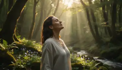 A serene person taking a deep breath outdoors in a peaceful, sunlit forest. Their eyes are closed, expressing profound relief and calm as they release physical tension. Morning sunlight filtering through the trees, photorealistic, high-end lifestyle photography.