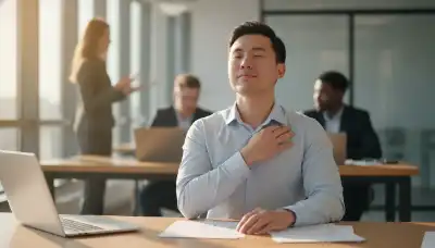 A realistic portrait of a young professional man in a bright office environment, sitting at his desk, pausing his work to gently tap his collarbone area, eyes closed, taking a deep breath. Soft sunlight coming through the window. The atmosphere feels like a moment of quick relief, emotional grounding, and stress management amidst a busy workday.