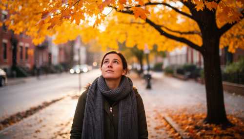 Photorealistic, vibrant close-up of a person walking down a street, looking attentively at the bright yellow and orange leaves of an autumn tree. The background is beautifully blurred (bokeh). Crystal clear detail, bright natural daylight, conveying a strong sense of grounding and external mindfulness.