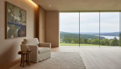 Photorealistic architectural shot of a serene and minimalist reading nook. A comfortable chair is strategically placed against a solid wall for back protection, looking out over a clutter-free, harmonious room towards a large window with a clear view of nature. Warm, indirect lighting, organic materials like wood and stone, conveying a deep sense of psychological safety. 8k, hyperrealistic.